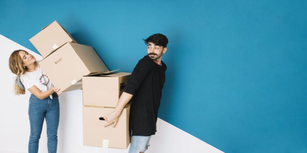modern-couple-moving-to-new-flat_23-2147707113